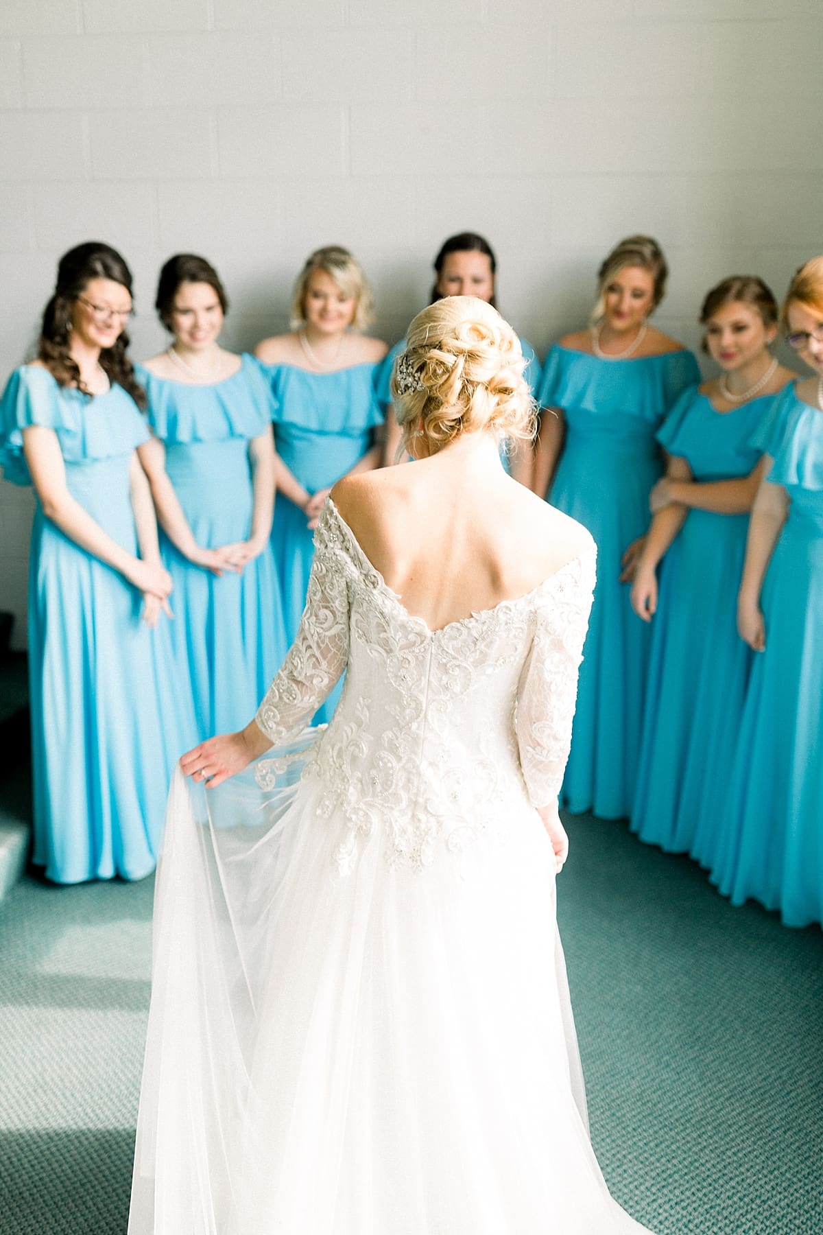 Arielle Peters Photography | Bridesmaids seeing the bride in her dress for the first time on fall wedding day.