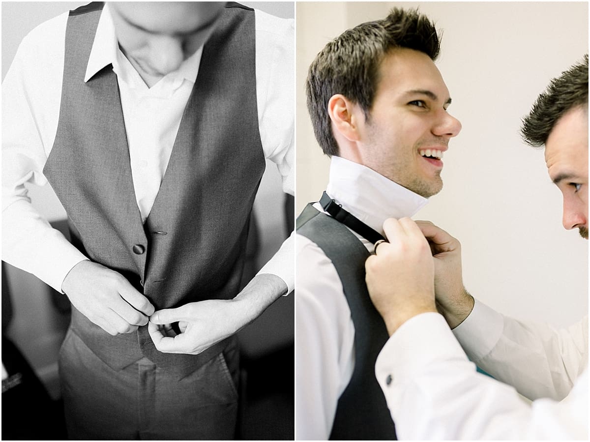 Arielle Peters Photography | Groomsman helping tie the groom's tie on his wedding day.