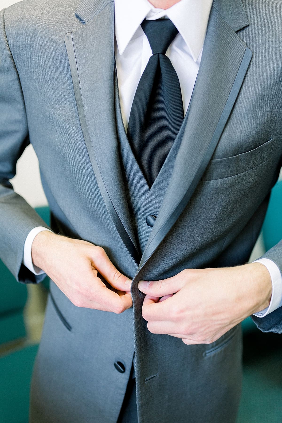 Arielle Peters Photography | Close up of the groom wearing his tux on his wedding day.