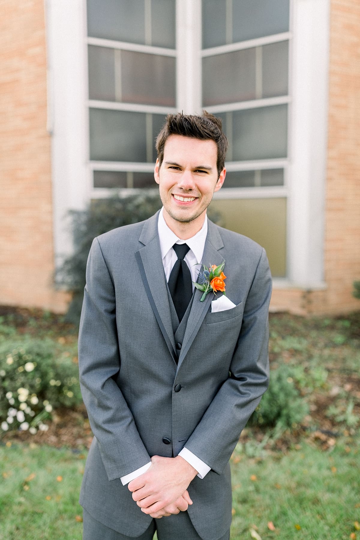 Arielle Peters Photography | Groom smiling outside on fall wedding day.