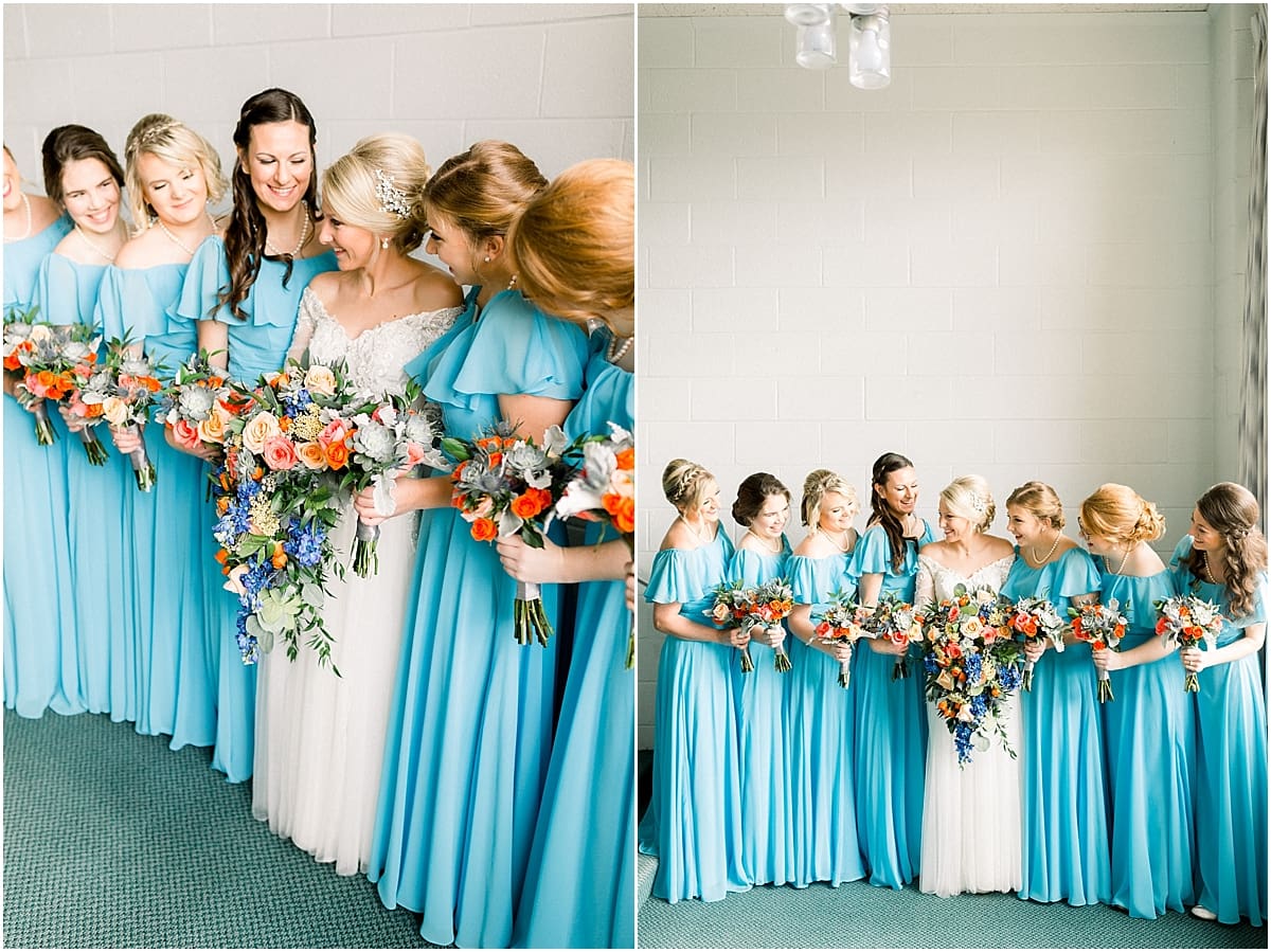 Arielle Peters Photography | Bride and bridesmaids lined up with bouquets smiling on fall wedding day.