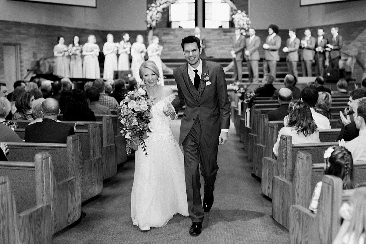 Arielle Peters Photography | Bride and groom walking down the aisle together on fall wedding day.
