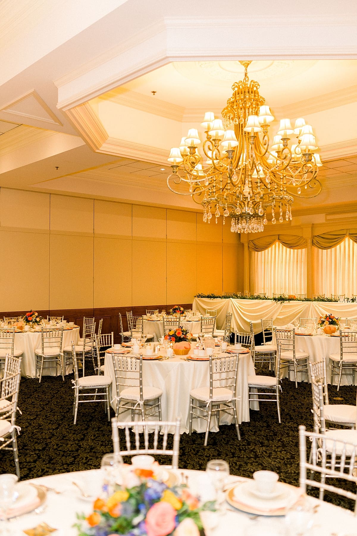 Arielle Peters Photography | Fall wedding table settings and flower arrangements at wedding reception venue.
