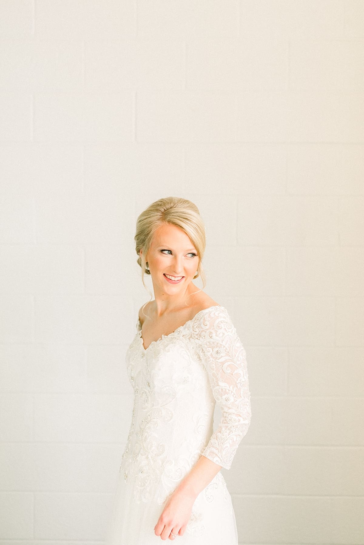 Arielle Peters Photography | Bride smiling in her dress on her fall wedding day.