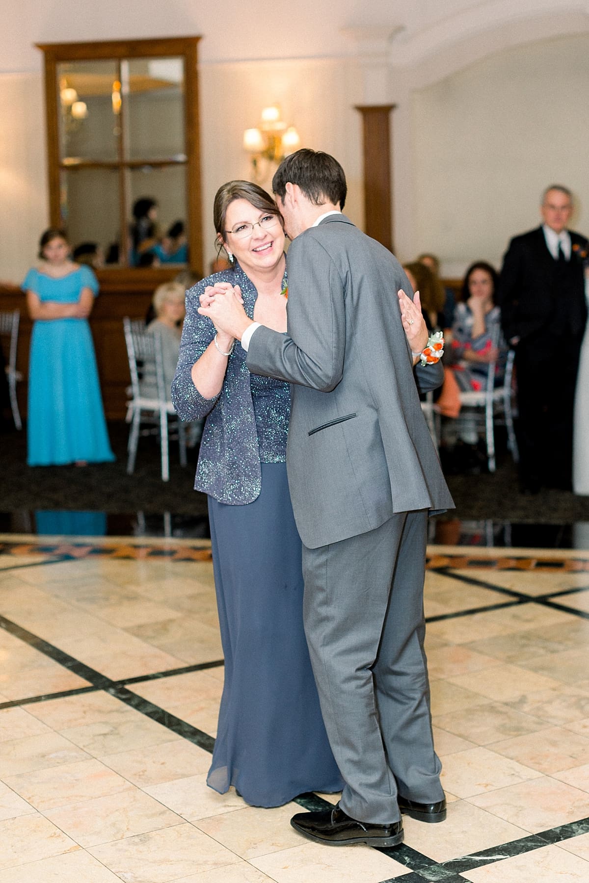 Arielle Peters Photography | Mother of the groom and the groom sharing a dance at fall wedding reception.