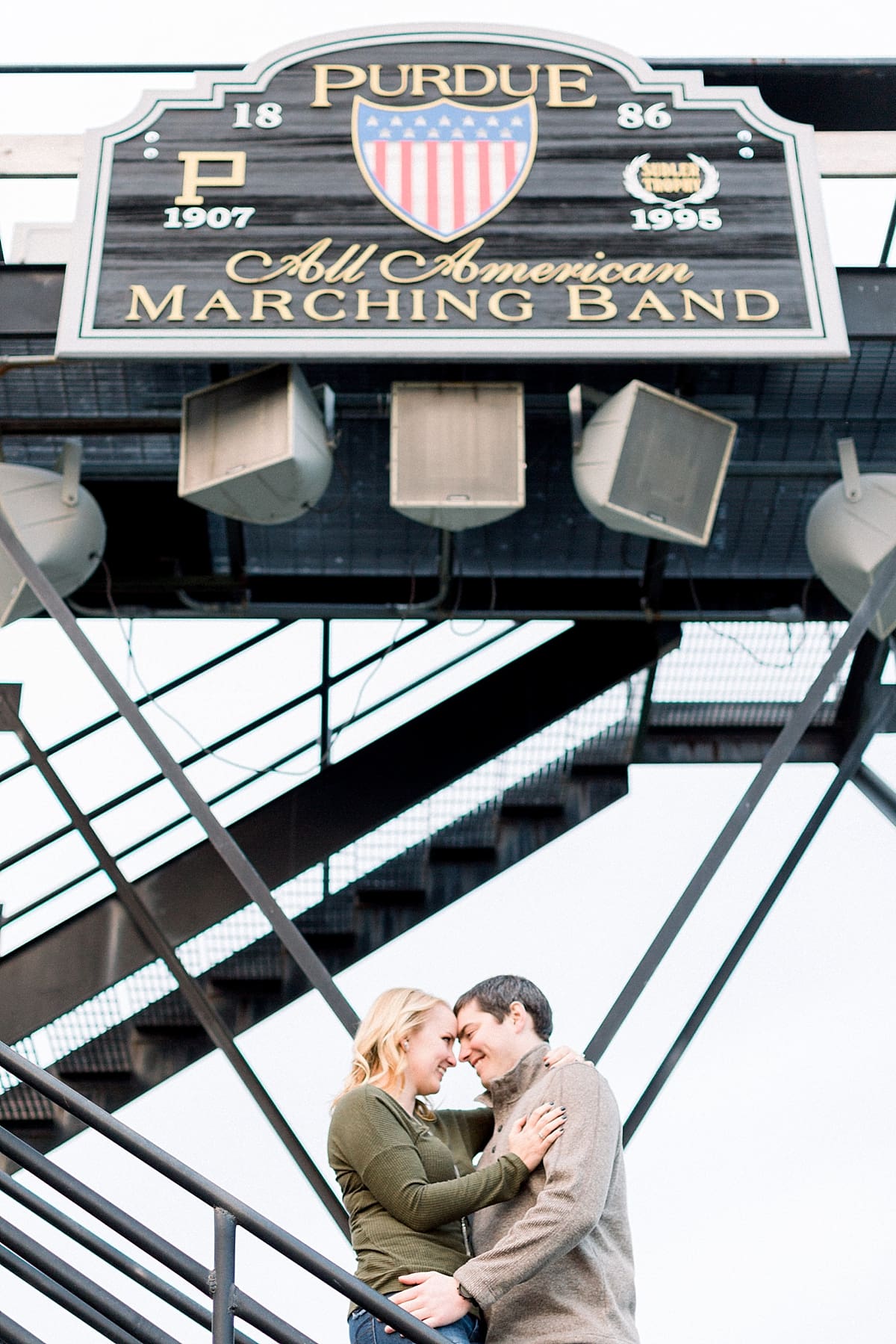Arielle Peters Photography | Couple smiling and taking fall engagement photos at Purdue University.