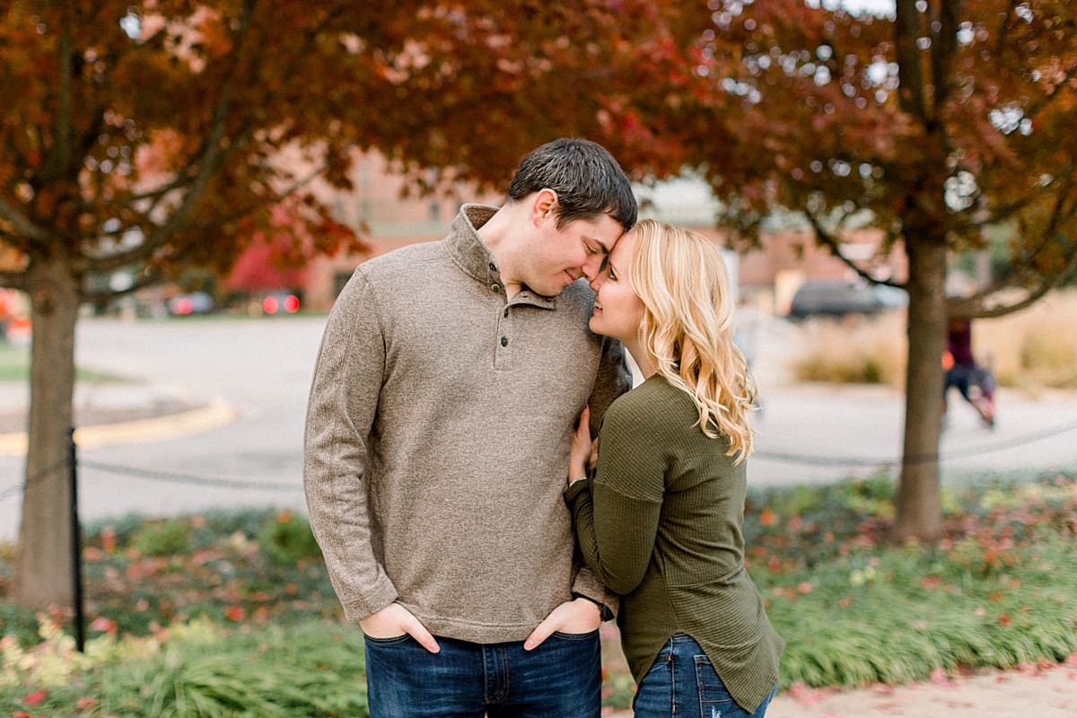 Arielle Peters Photography | Couple smiling and taking fall engagement photos at Purdue University.