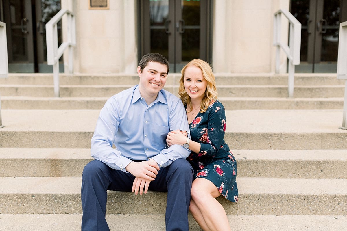Arielle Peters Photography | Couple sitting on steps and taking fall engagement photos at Purdue University.