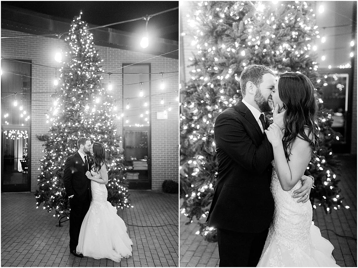 Arielle Peters Photography | Bride and groom kissing by Christmas tree on wedding day.