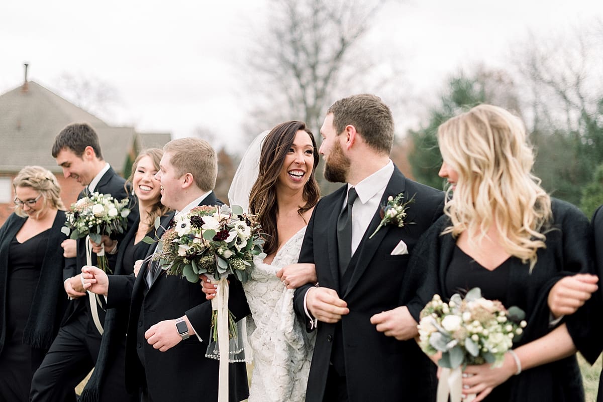 Arielle Peters Photography | Bride and Groom with wedding party on golf course on wedding day.