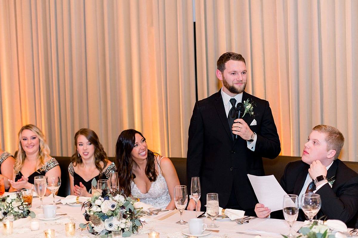 Arielle Peters Photography | Bride and groom at head table at wedding reception.