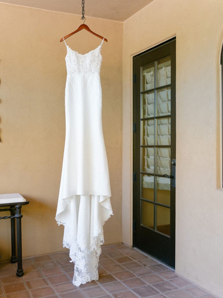 Brides dress hanging at Blackstone Country Club wedding venue in Arizona. 