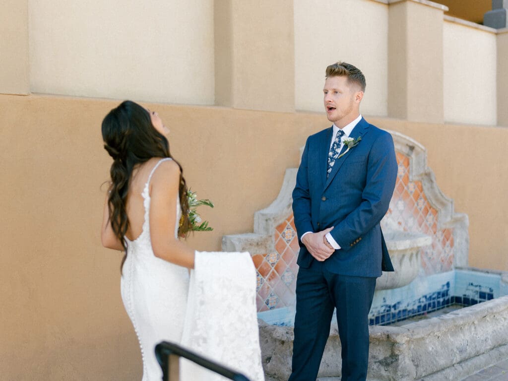 Groom in shock as he sees his bride for the first time during their first looks at Black Stone Country Club in Peoria, Arizona.