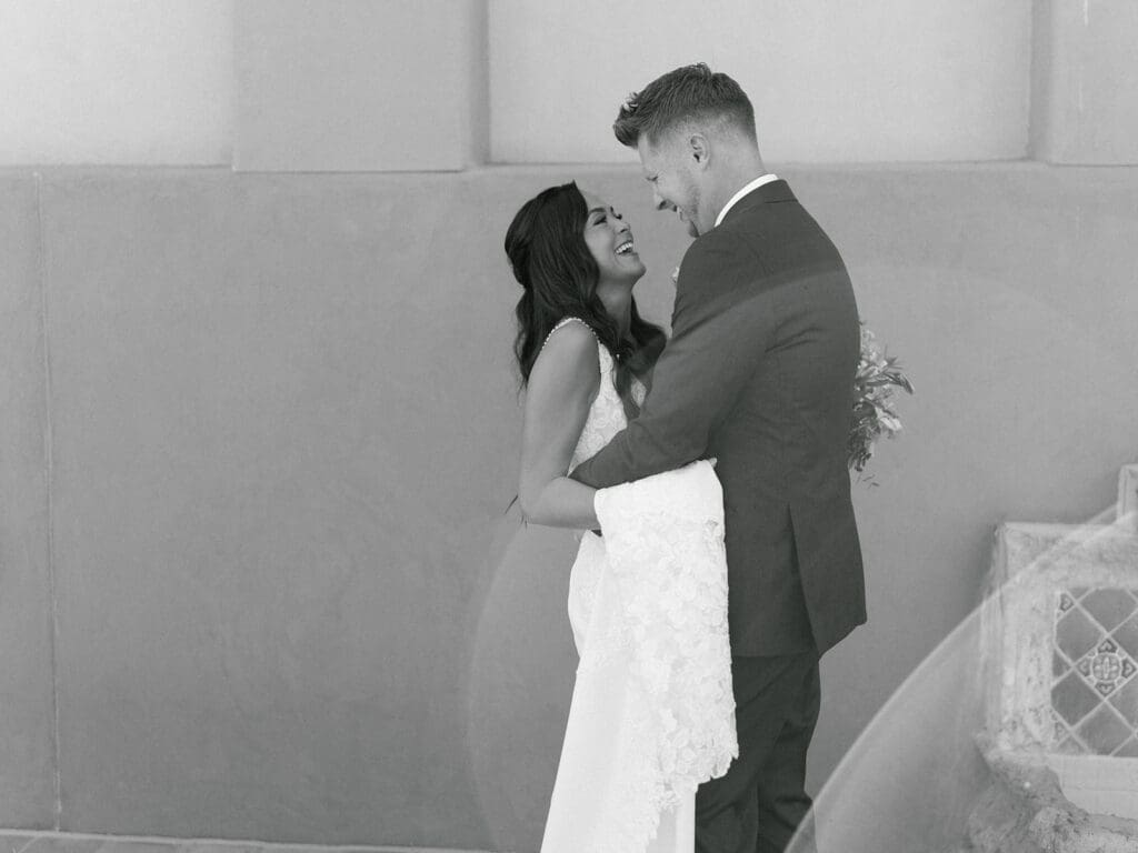 Black and white photo of a bride and groom after sharing their first looks at Black Stone Country Club in Peoria, Arizona. 