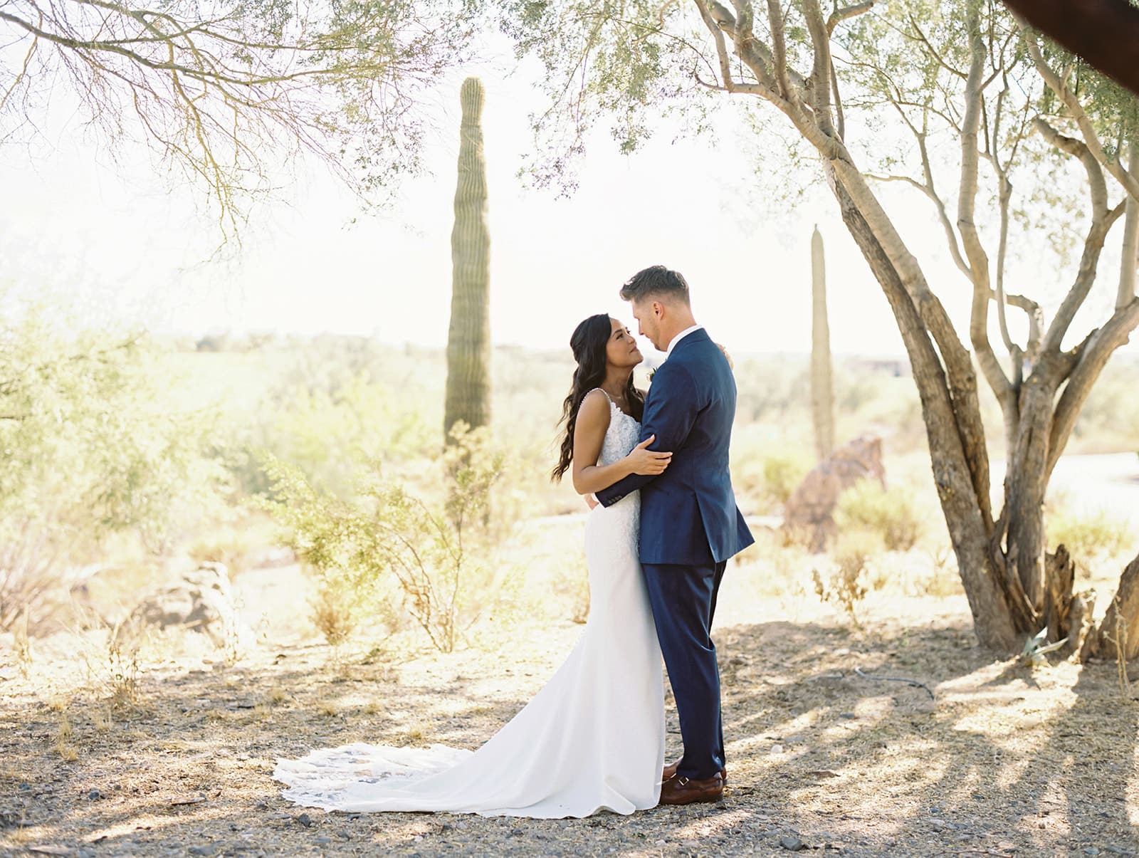 Bride and groom looking at each other for their portraits at Blackstone Country Club - Arizona desert wedding venue in Peoria.
