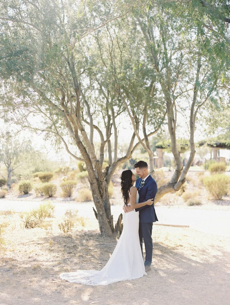 Bride and groom looking at each other for their portraits at Blackstone Country Club - Arizona desert wedding venue in Peoria.