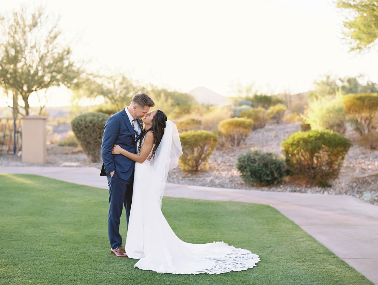 Bride and grooms sunset wedding portraits at Blackstone Country Club - Arizona desert wedding venue. 