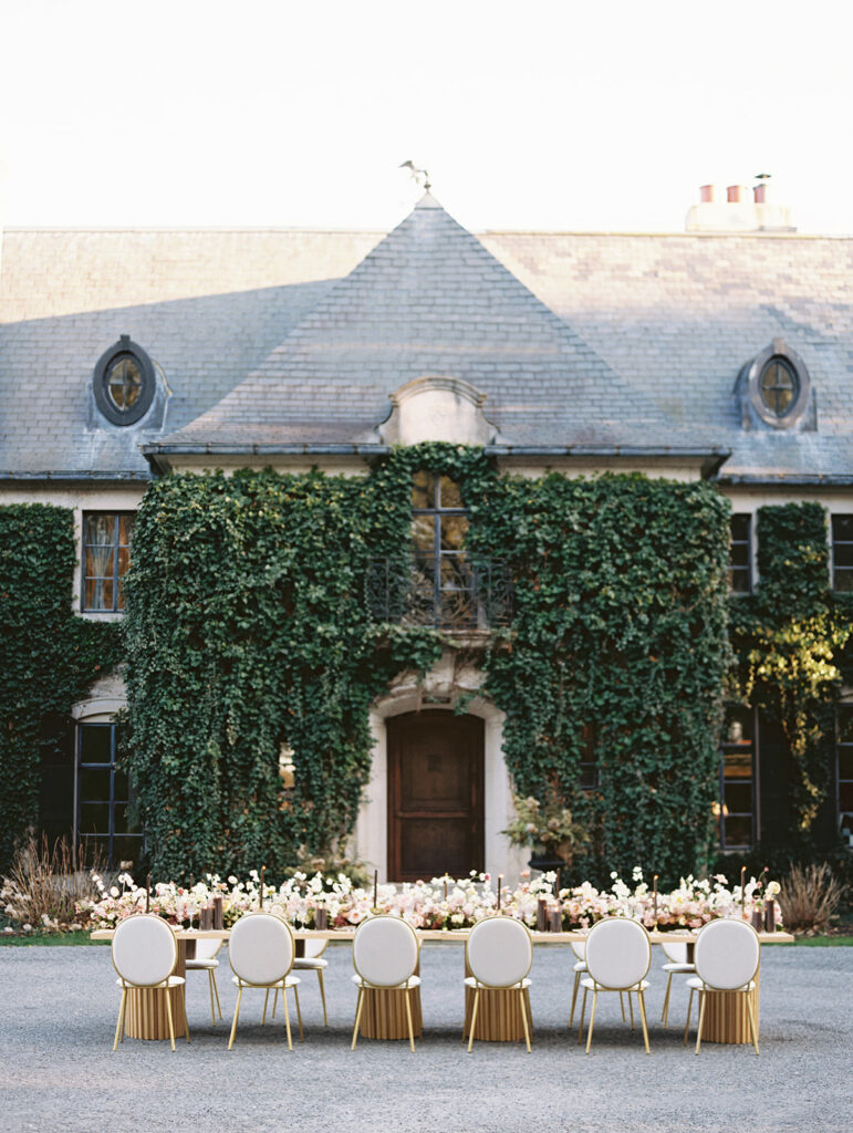 Long Greencrest Manor wedding reception tables with florals by LB Floristry, candles by Applewood Candles Co, and rentals from PR Rentals, and linens from BBJ La Tavola,