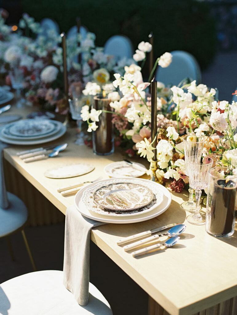 Long wedding reception tables with florals by LB Floristry, candles by Applewood Candles Co, and rentals from PR Rentals, and linens from BBJ La Tavola,
