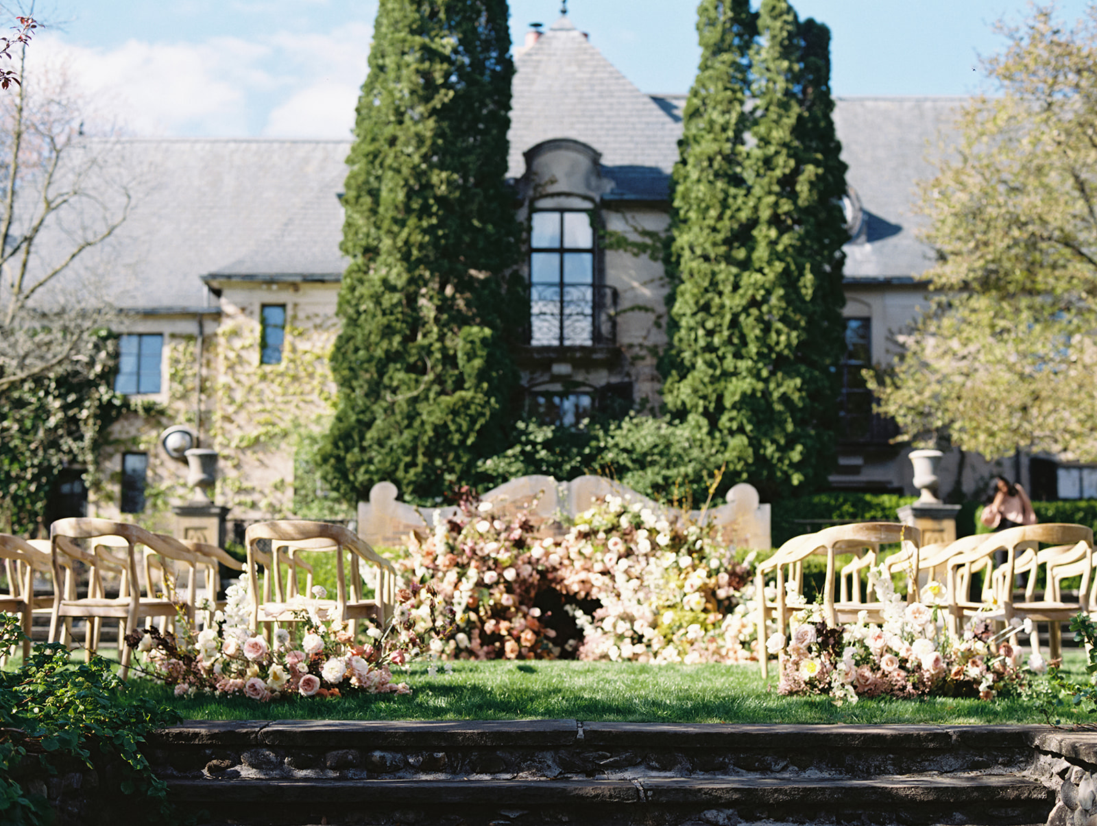 Outdoor Greencrest Manor wedding ceremony with florals by LB Floristry
