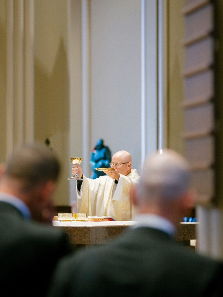 An indoor Catholic wedding ceremony at Basilica of the Sacred Heart in Indiana