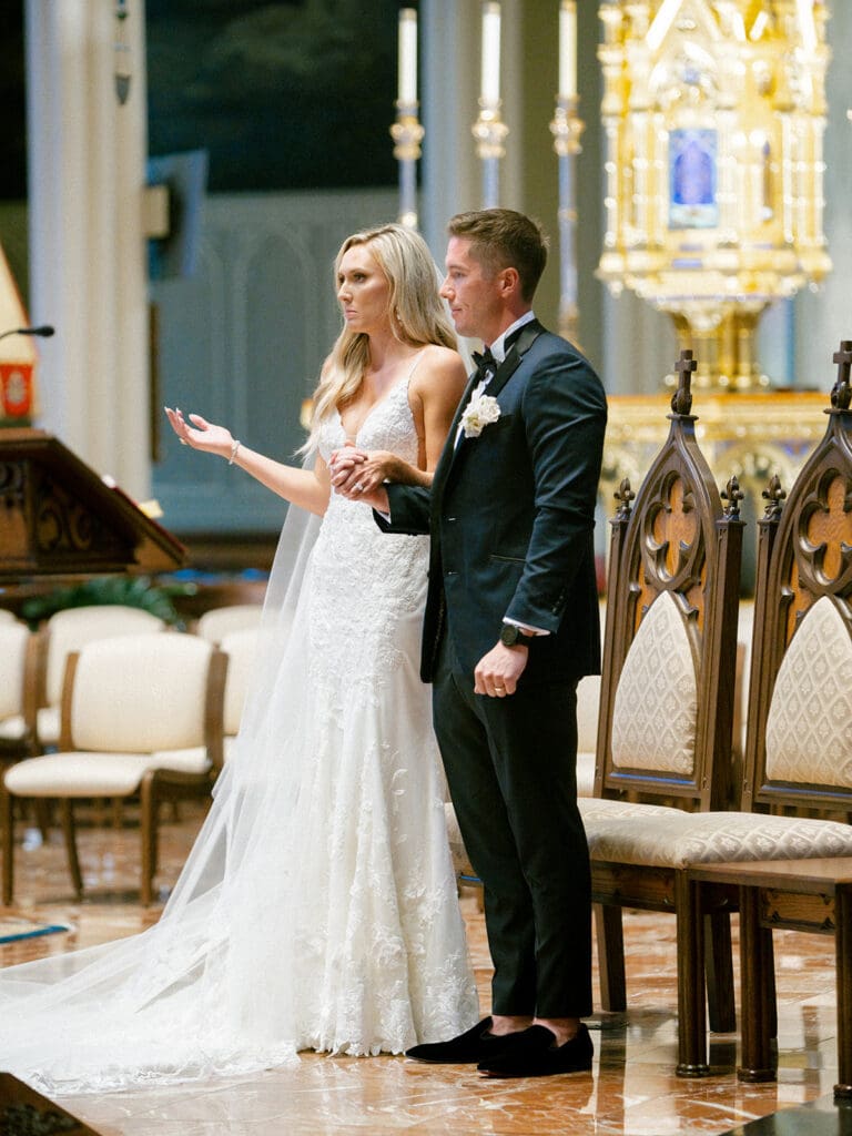 An indoor Catholic wedding ceremony at Basilica of the Sacred Heart in Indiana