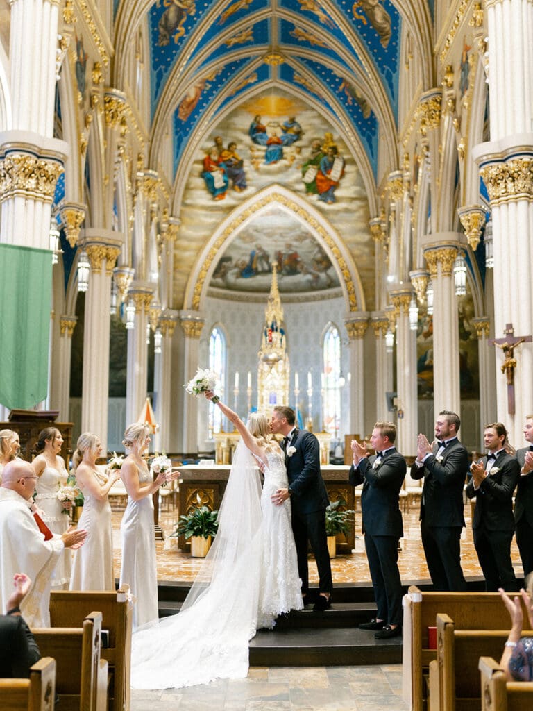 An indoor Catholic wedding ceremony at Basilica of the Sacred Heart in Indiana