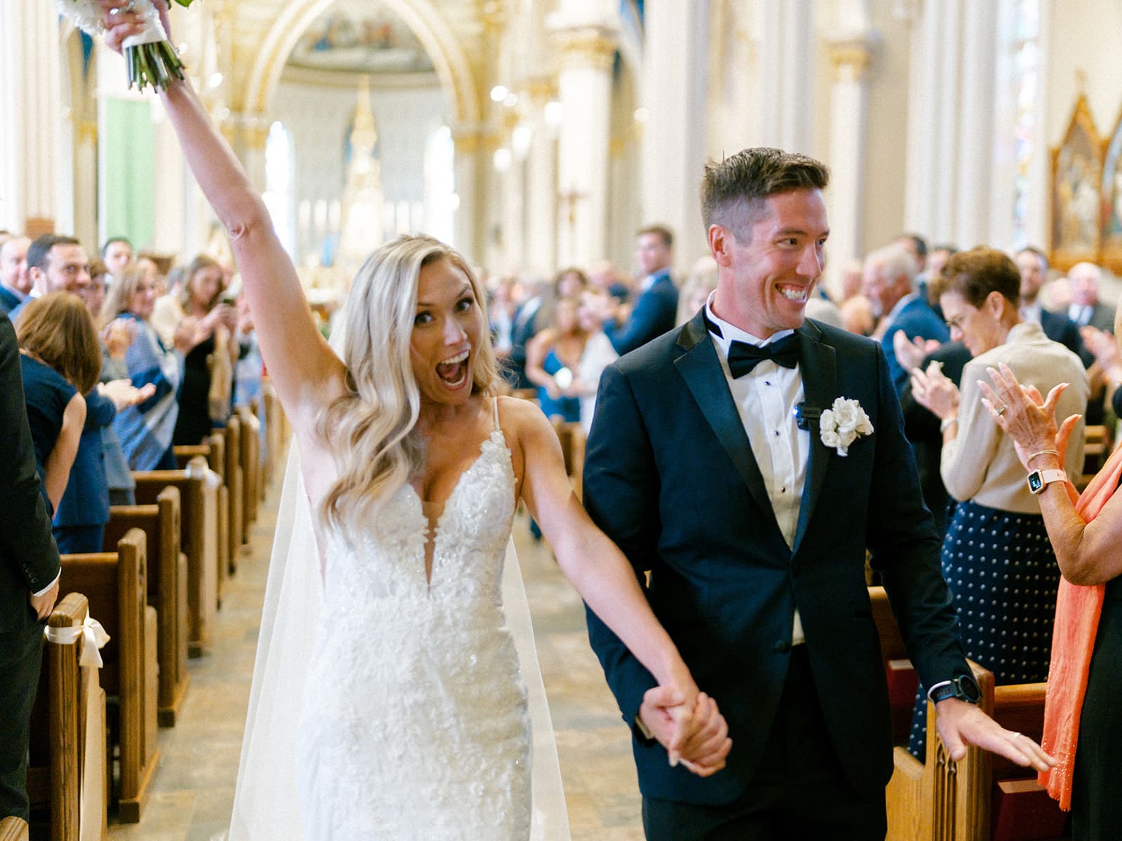 An indoor Catholic wedding ceremony at Basilica of the Sacred Heart in Indiana