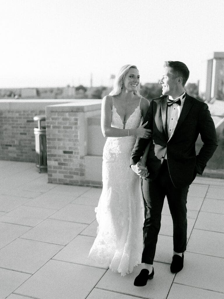 Bride and grooms black and white sunset portraits on a rooftop during their Notre Dame wedding in Indiana