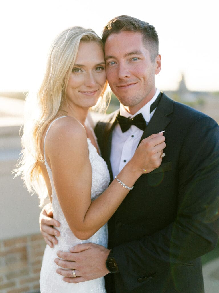 Bride and grooms sunset portraits on a rooftop during their Notre Dame wedding in Indiana