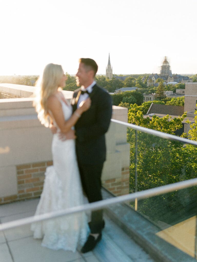Bride and grooms sunset portraits on a rooftop during their Notre Dame wedding in Indiana