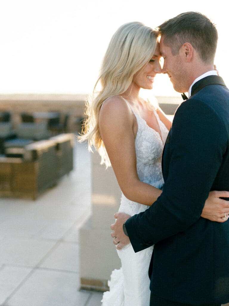 Bride and grooms sunset portraits on a rooftop during their Notre Dame wedding in Indiana