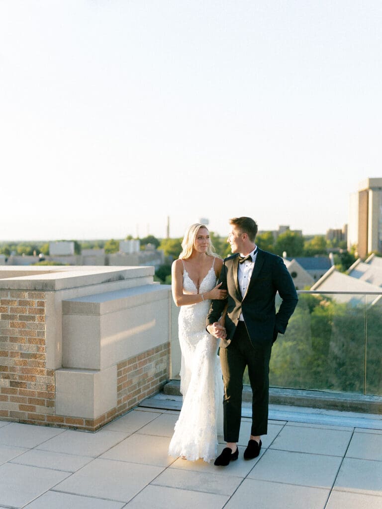 Bride and grooms sunset portraits on a rooftop during their Notre Dame wedding in Indiana