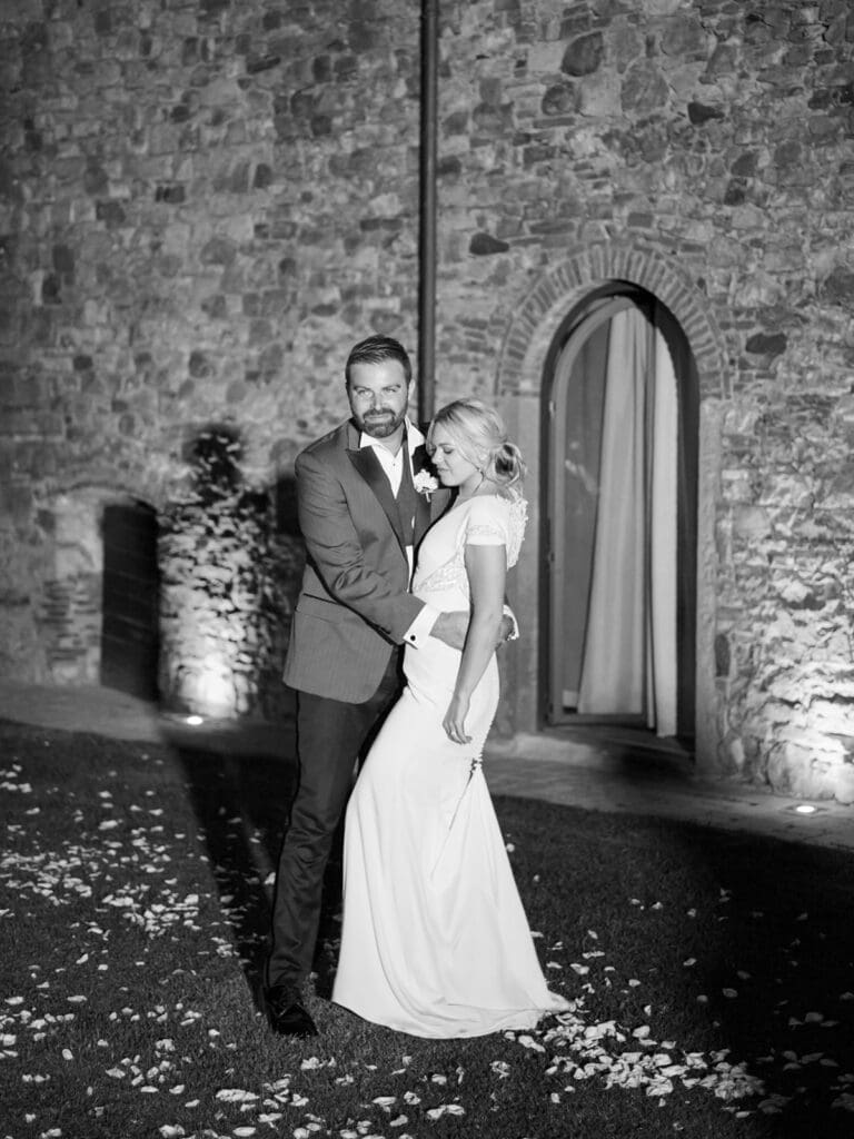 Black and white photo of a bride and groom dancing during their wedding reception