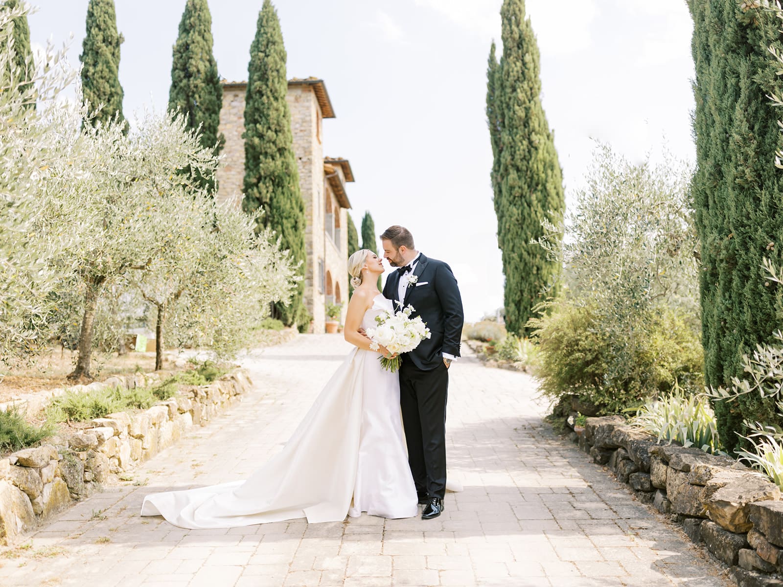 Bride and grooms portraits from their summer wedding in Tuscany, Italy at Villa Petrea