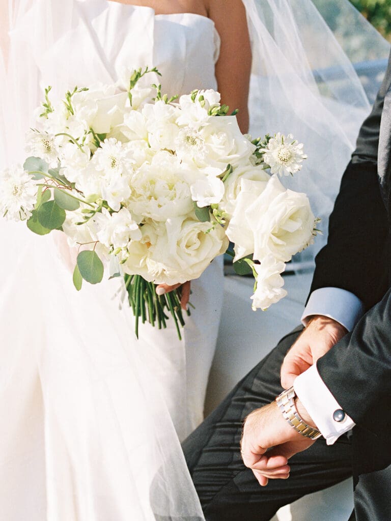 Close up shot of a bride holding her wedding bouquet