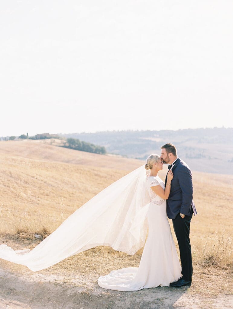 Sunrise bride and groom portraits at Chapel Vitalenta in Sienna, Italy