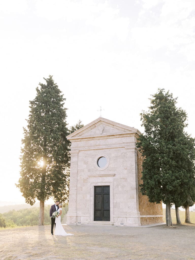 Sunrise bride and groom portraits at Chapel Vitalenta in Sienna, Italy