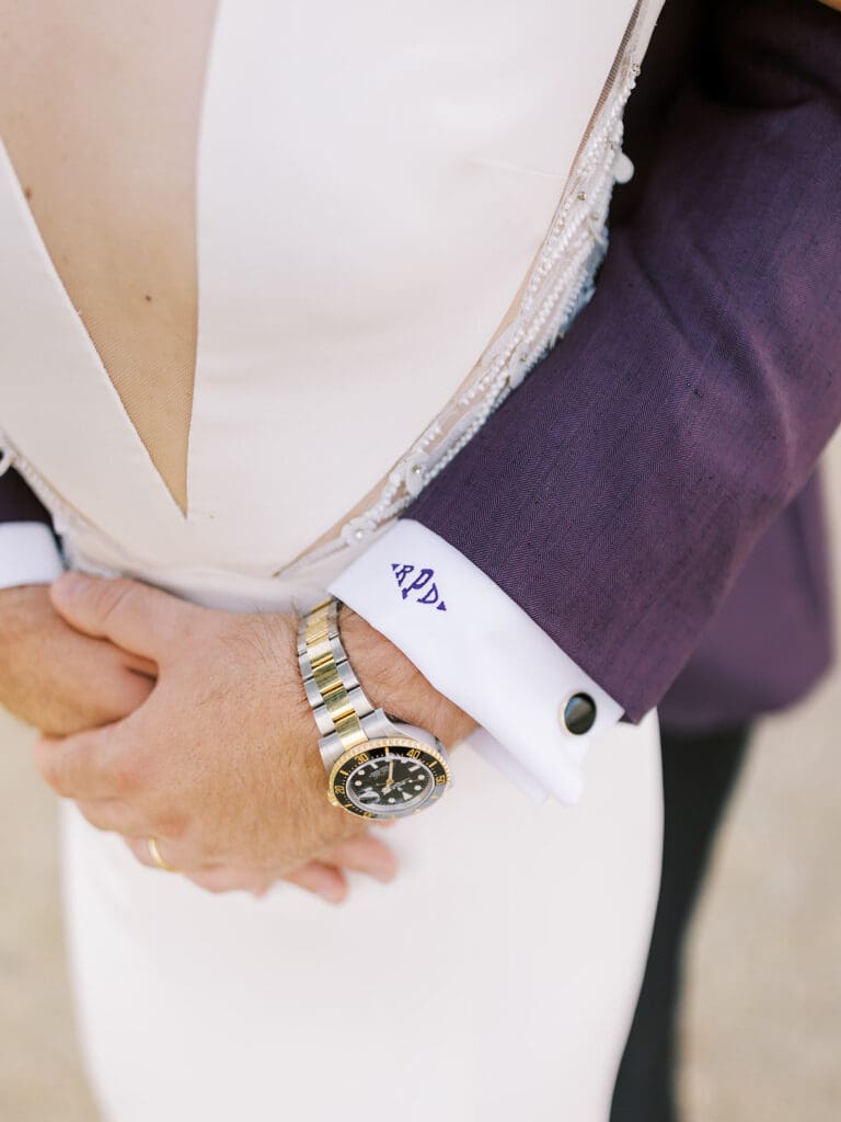 Close up shot of a groom holding his bride