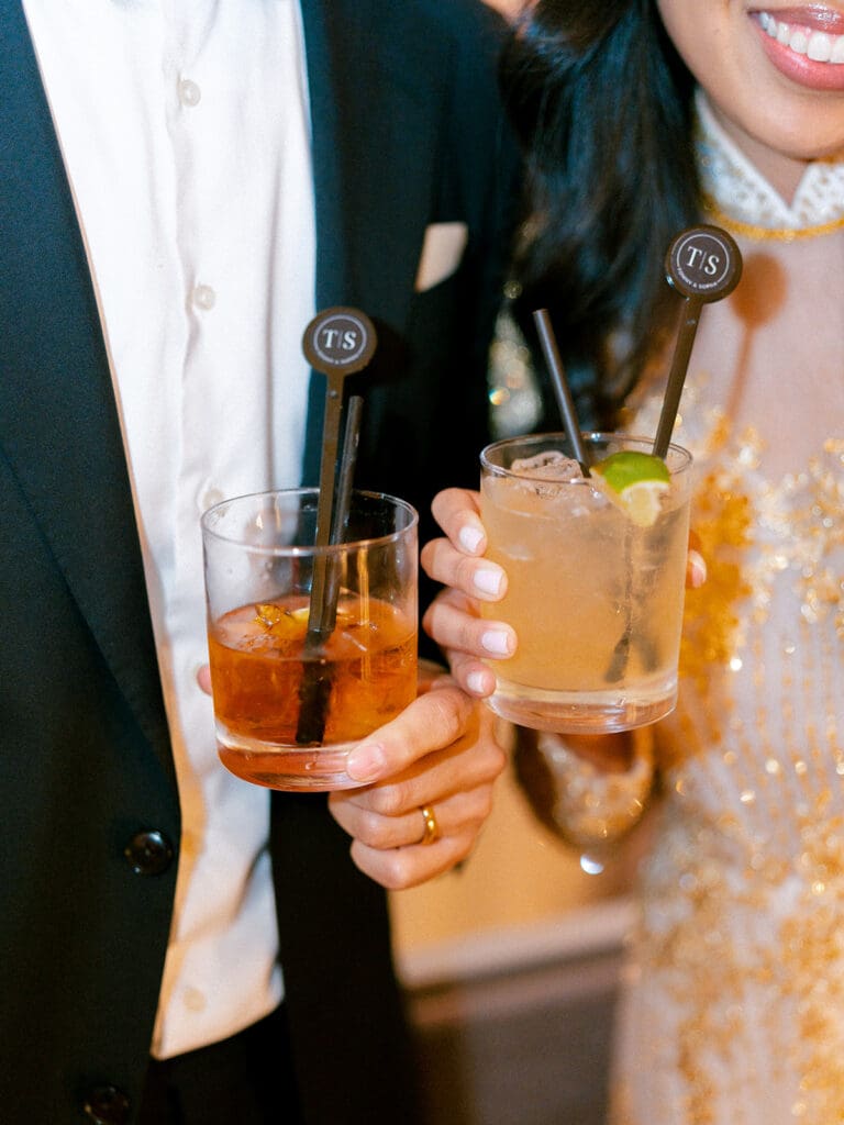 Bride and groom having drinks during their wedding reception