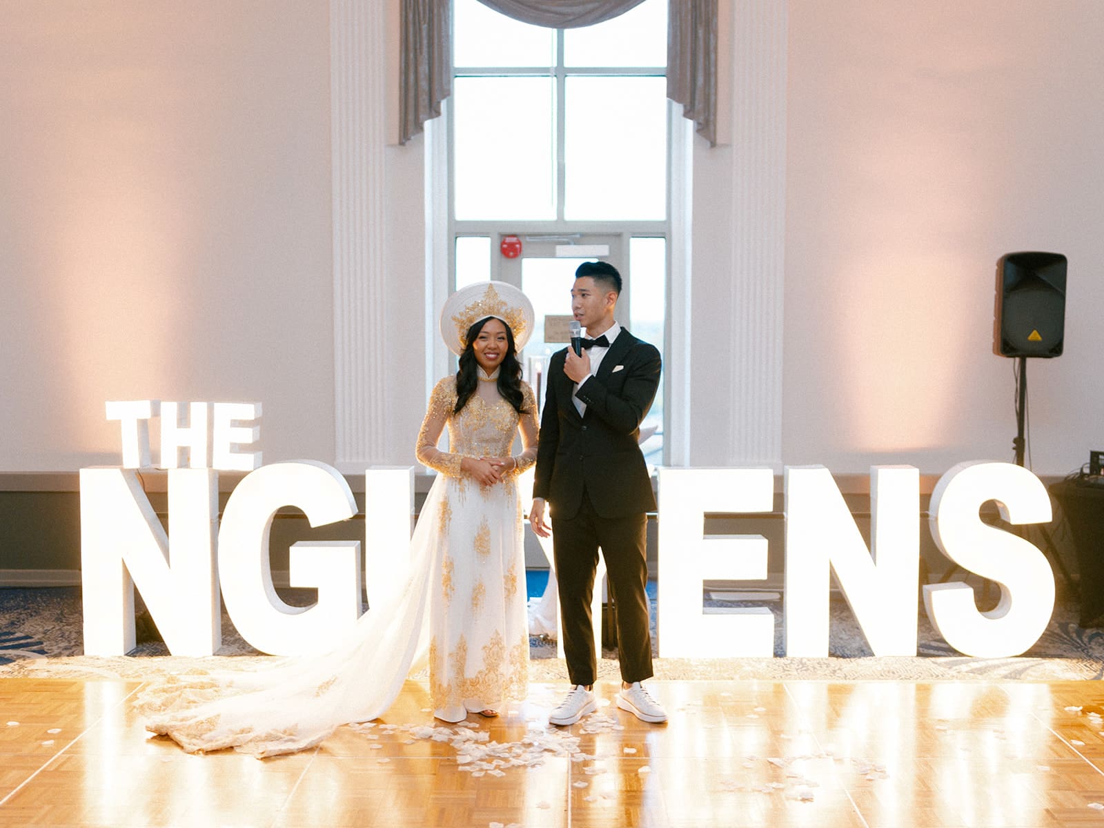 Bride and groom giving a speech during their wedding reception