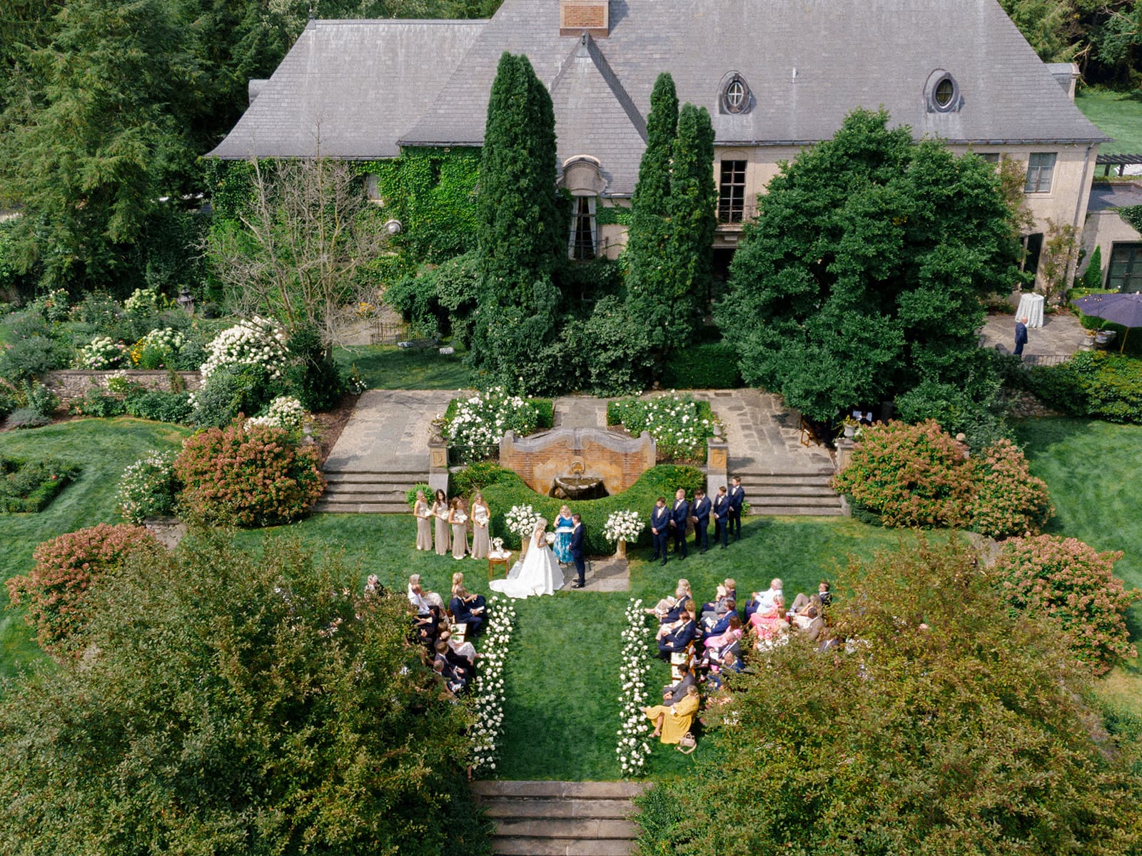 Drone shot of a classic outdoor Greencrest Manor wedding ceremony in Battle Creek, Michigan