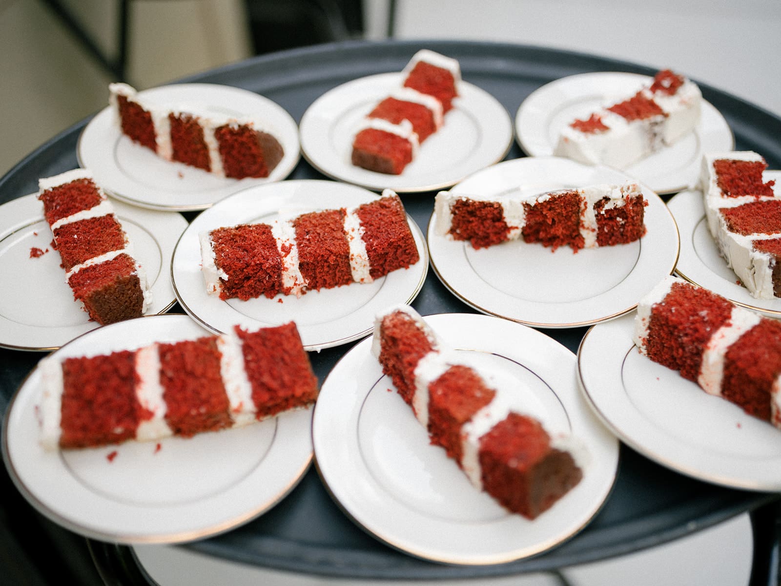 Slices of wedding cake being served at the reception 