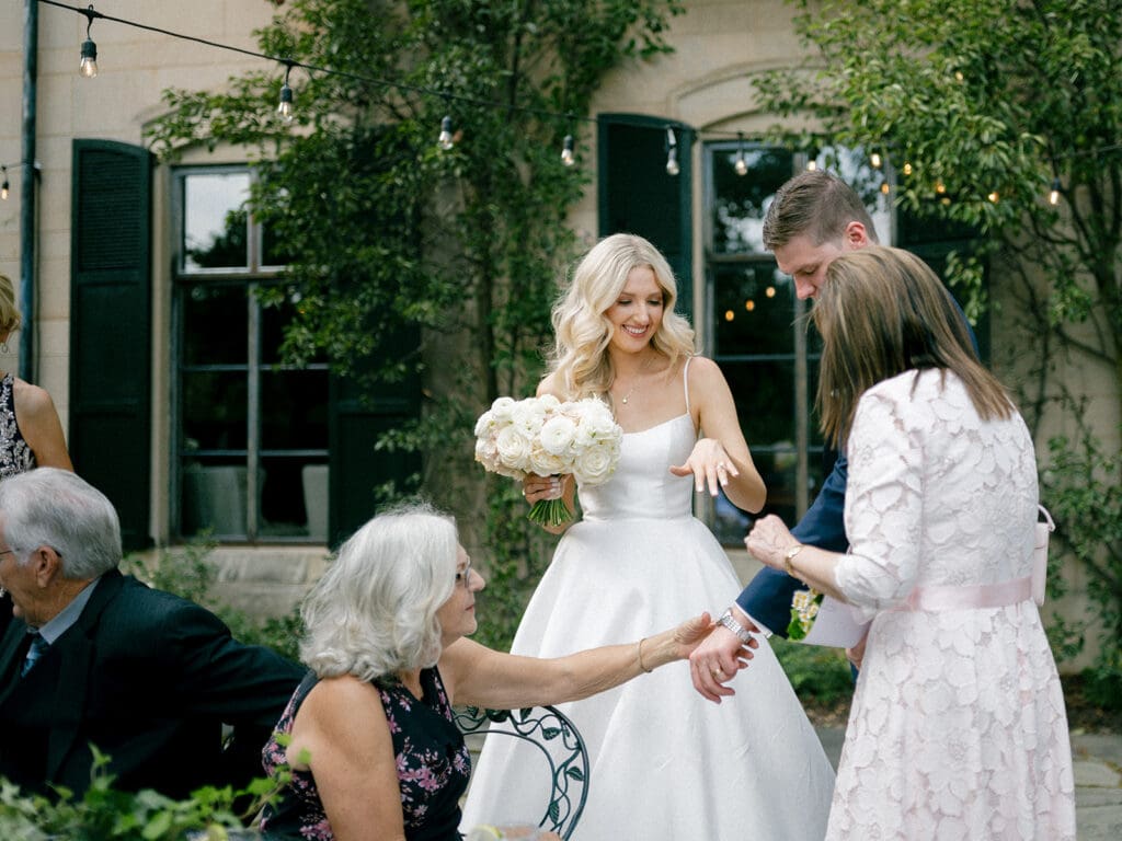 Bride and groom mingling during cocktail hour