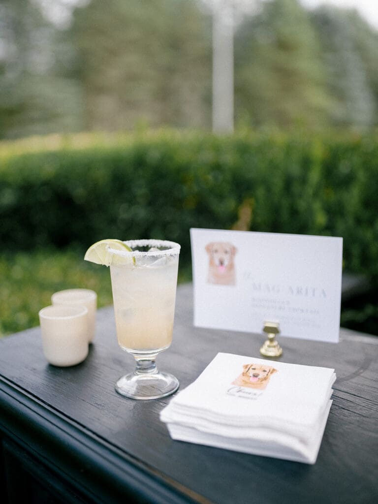 Cocktail hour bar with custom napkins of the couples dog