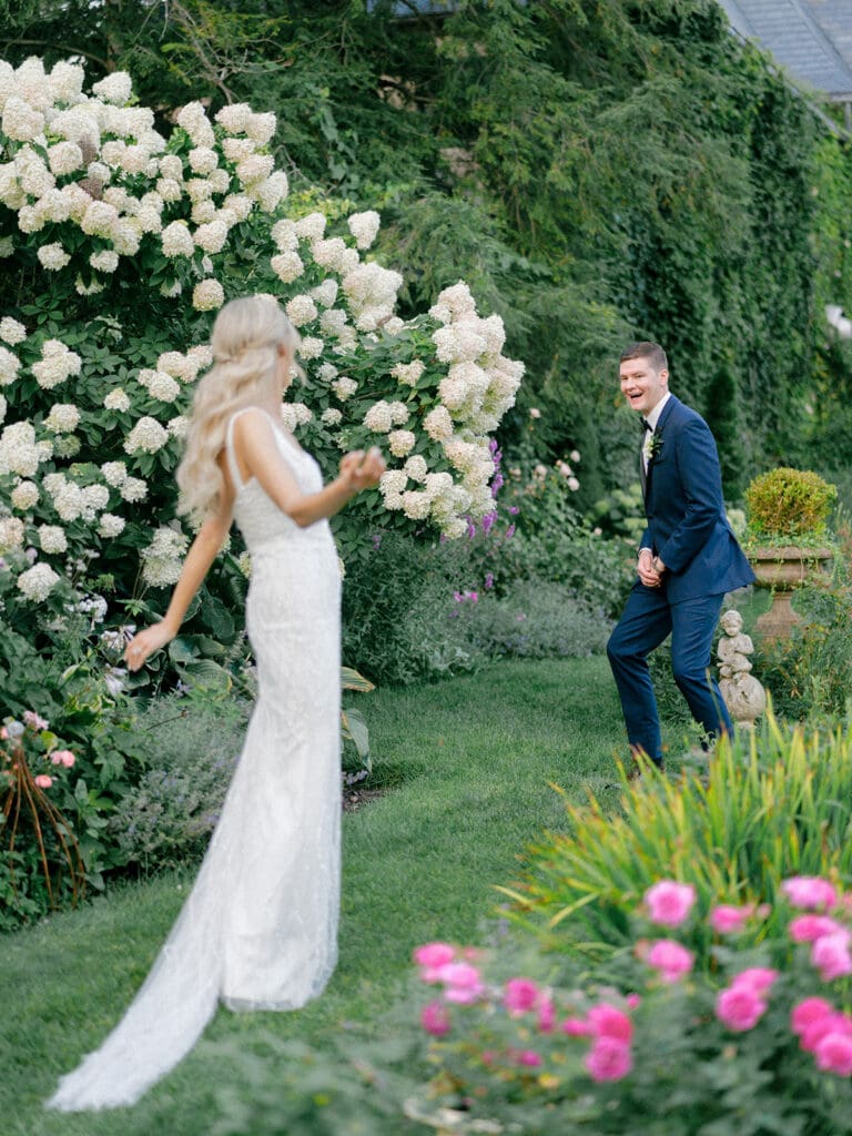 Bride and grooms "second look" during the brides wedding reception dress change in the gardens of Greencrest Manor wedding venue in Battle Creek, Michigan