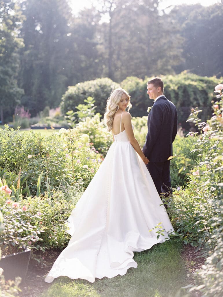 Bride and grooms sunset garden portraits at Greencrest Manor wedding venue in Battle Creek, Michigan captured on film. 