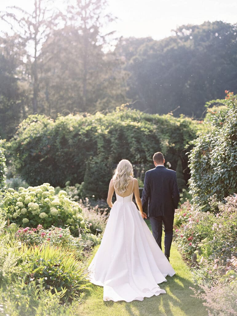 Bride and grooms sunset garden portraits at Greencrest Manor wedding venue in Battle Creek, Michigan captured on film. 