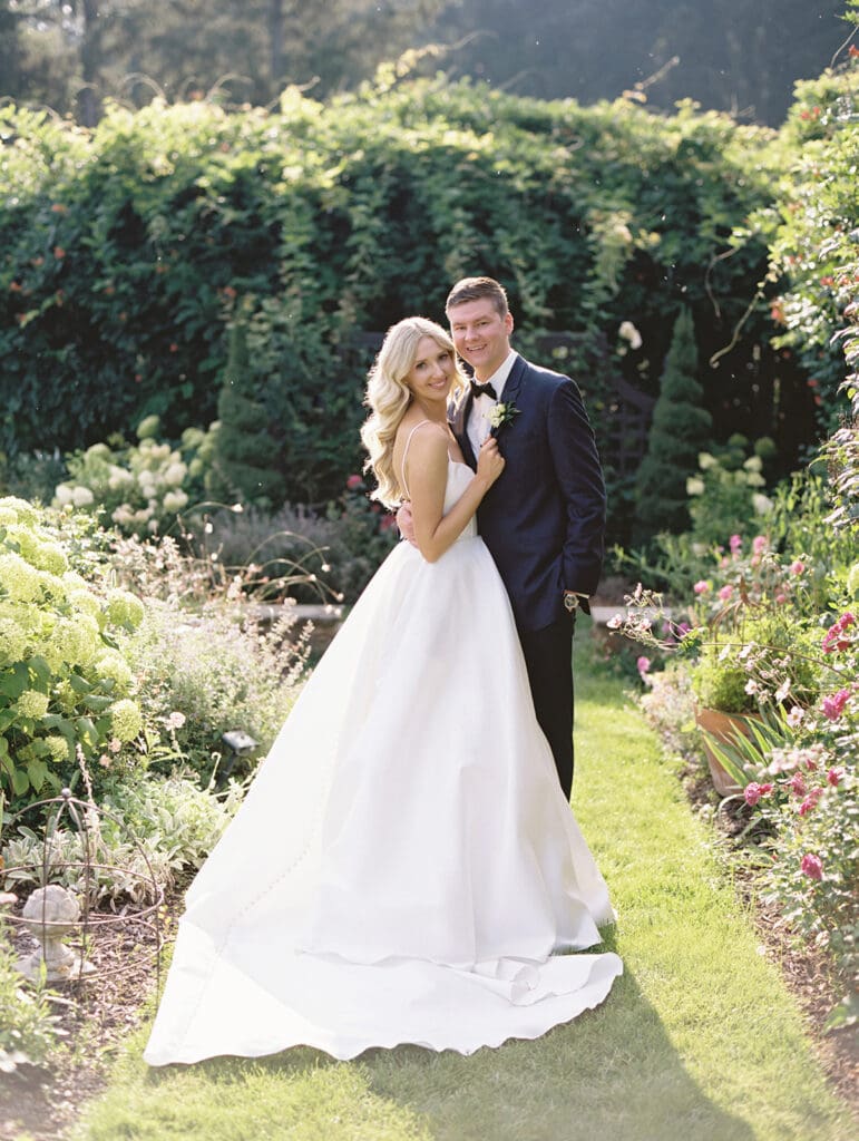 Bride and grooms sunset garden portraits at Greencrest Manor wedding venue in Battle Creek, Michigan captured on film. 