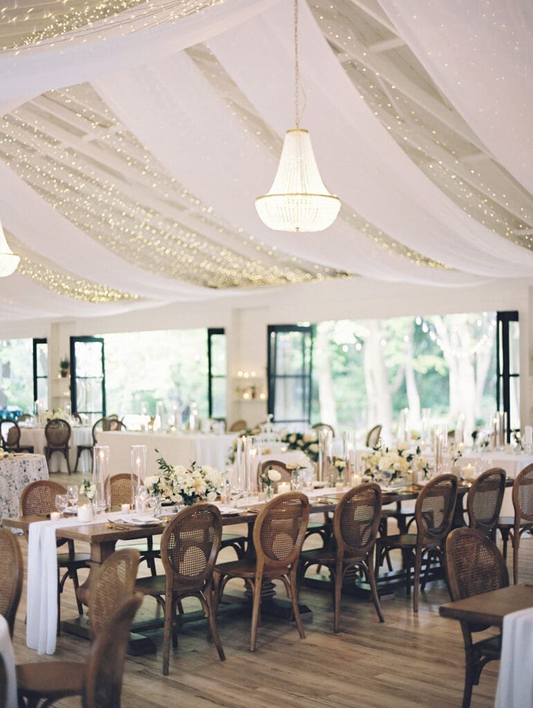 An elegant indoor Greencrest Manor wedding reception in the celebration house. 